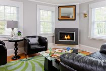 Living room with gas fireplace, couch, and leather chairs