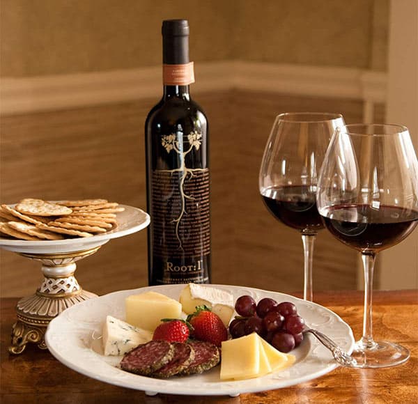 Red wine and cheese plate with crackers