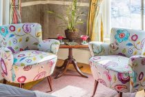 Two comfy chairs in Florence Room with drinks